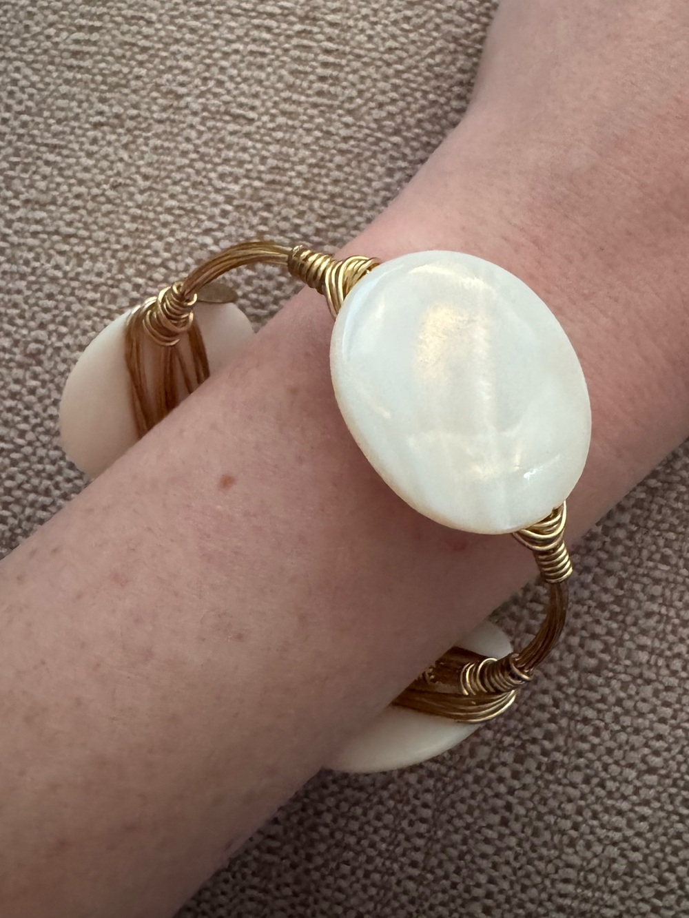 Gold Wire Bracelet with White Mother‑of‑Pearl Oval Accent